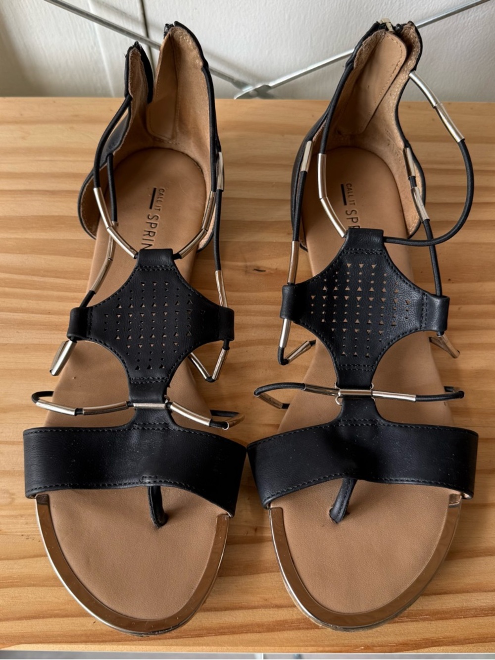 Black Gladiator-Style T-Strap Sandals with Metallic Accents